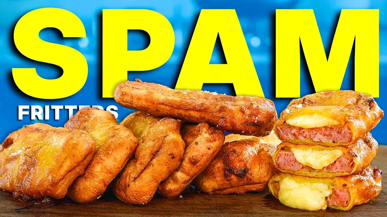 Fried spam fritters stacked on a wooden surface, with melted cheese visible. Large yellow text "SPAM" and blue background.