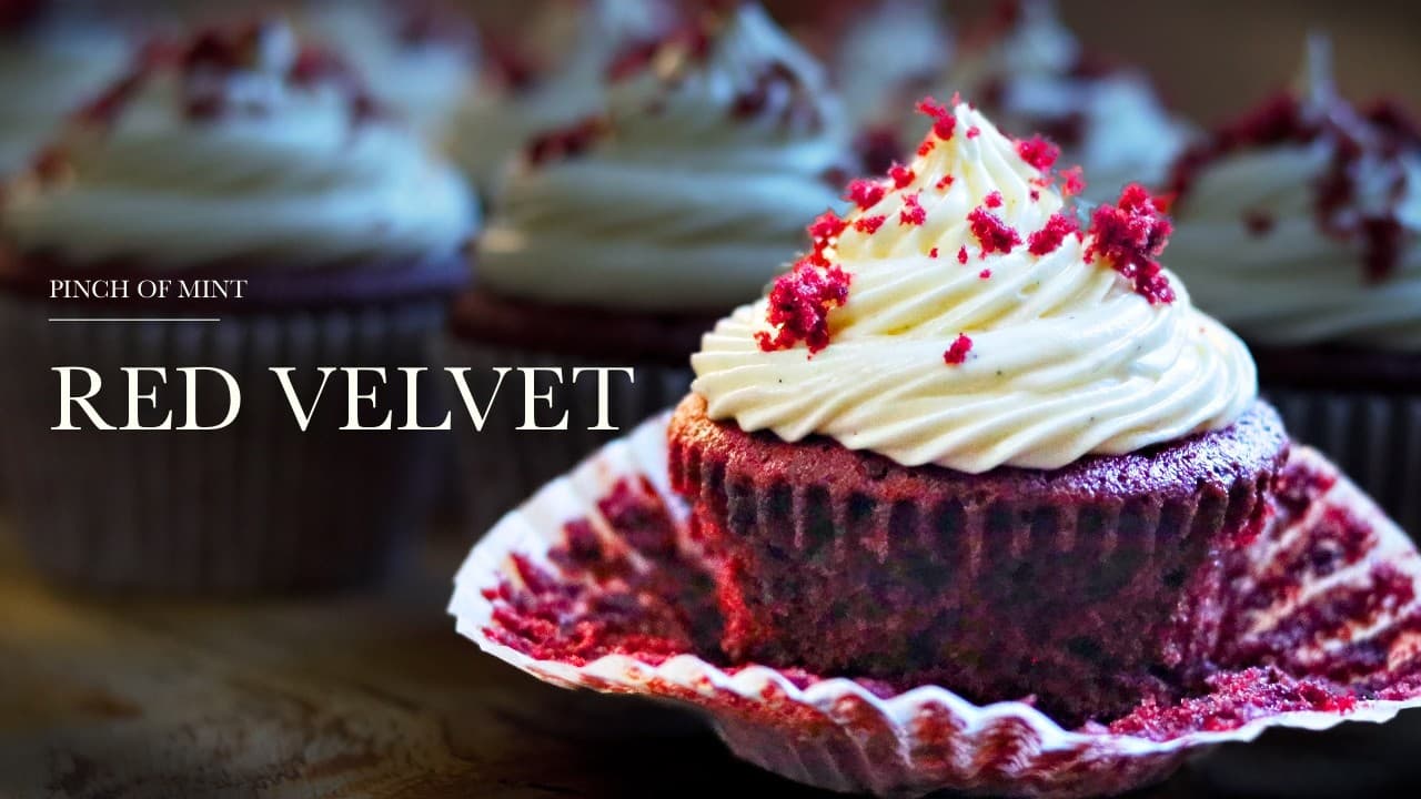 Red velvet cupcakes, a still from its video, with the channel name and the recipe title in text across it